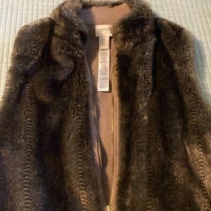 Sleeveless vest with gold zipper, tan sweater material on back.  Fits small